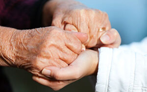 holding hands - daughter of dementia